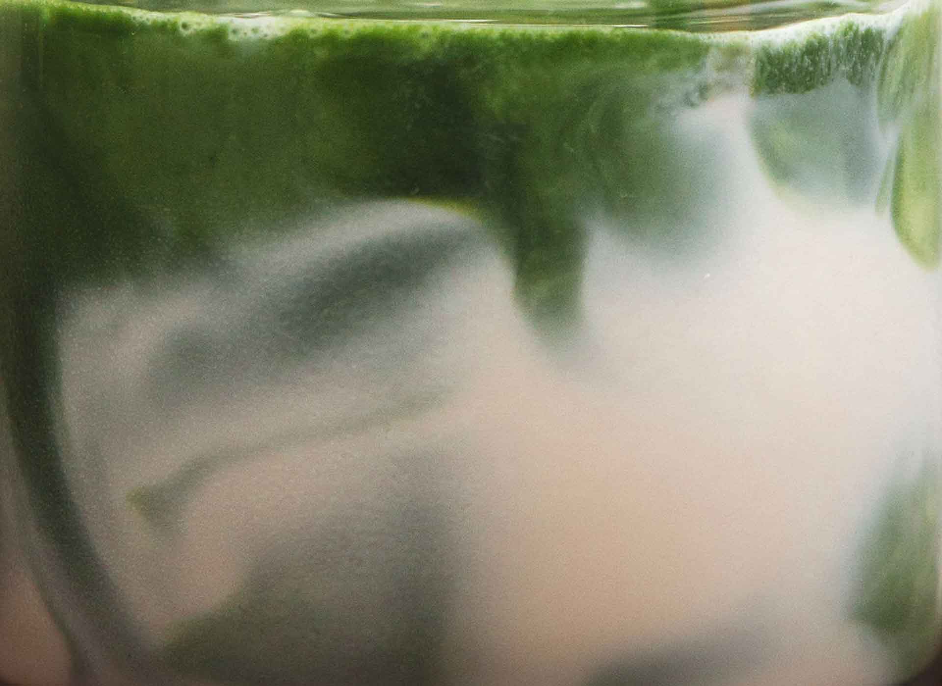 Organic ceremonial matcha mixing in milk by Idyll