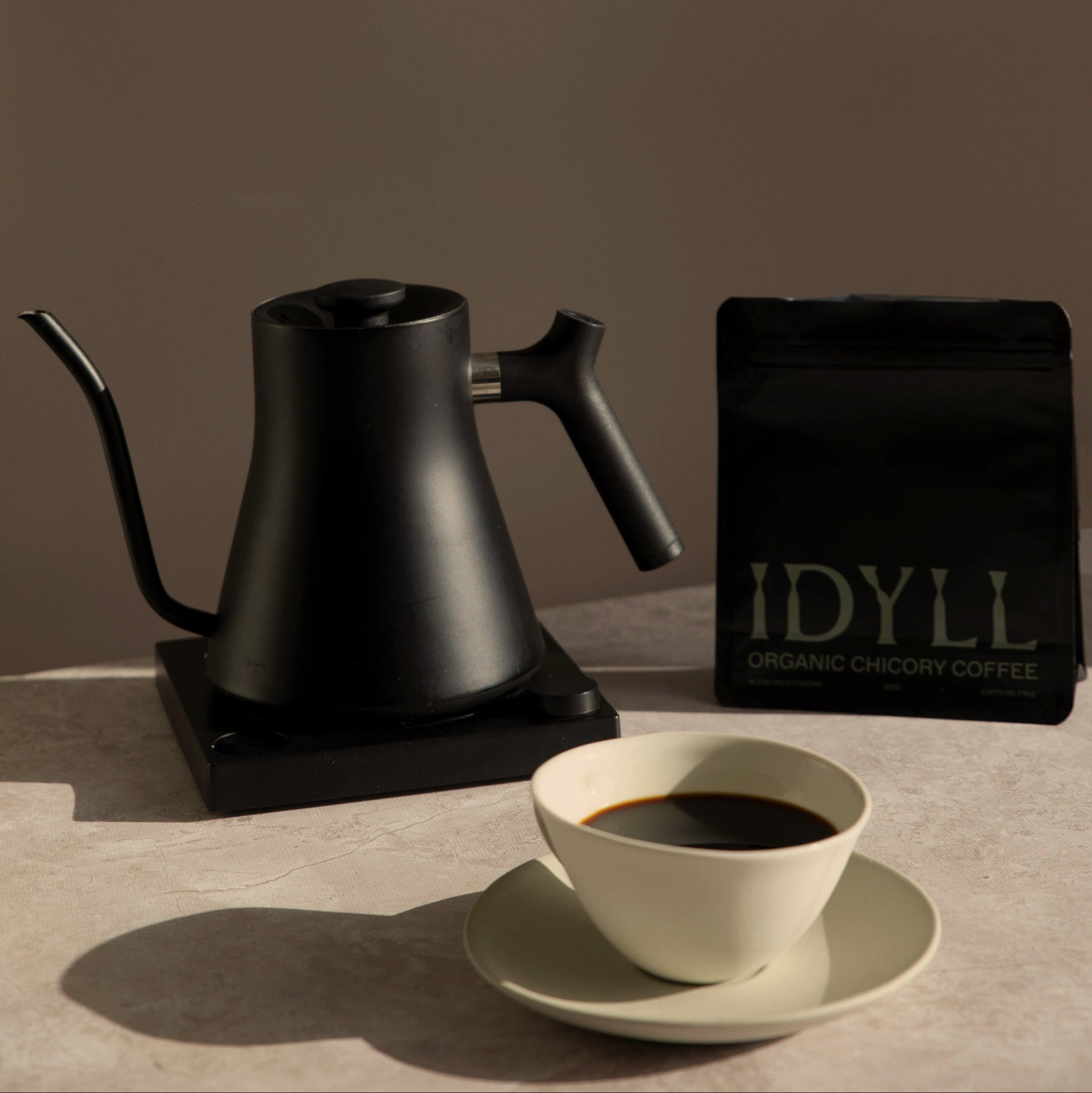 Organic caffeine-free chicory coffee next to black kettle by Idyll
